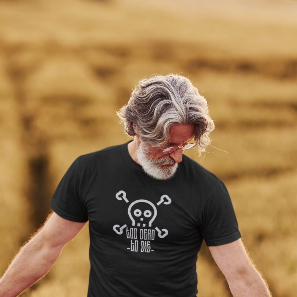 old man wearing motivational tshirt with quote "too dead to die" with skull graphic