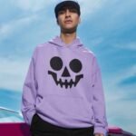 men wearing hoodie printed with skeleton emoji